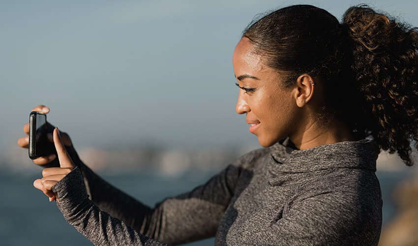 A lady looking at her phone